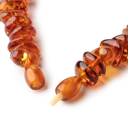 15x10-23x17mm Baltic Amber Plain Nugget Beads 20 inch 90 pieces (ONLINE ORDER ONLY)