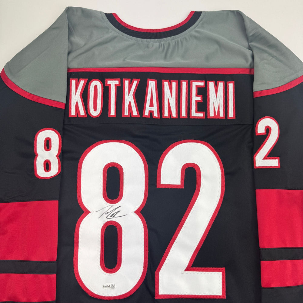 Autographed/Signed Jesperi Kotkaniemi Carolina Black Hockey Jersey Beckett BAS COA (ONLINE ORDER ONLY)
