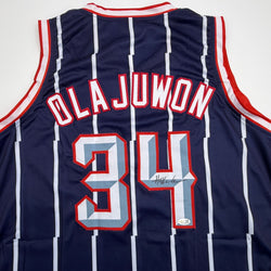 Autographed/Signed Hakeem Olajuwon Houston Blue Basketball Jersey JSA COA (ONLINE ORDER ONLY)