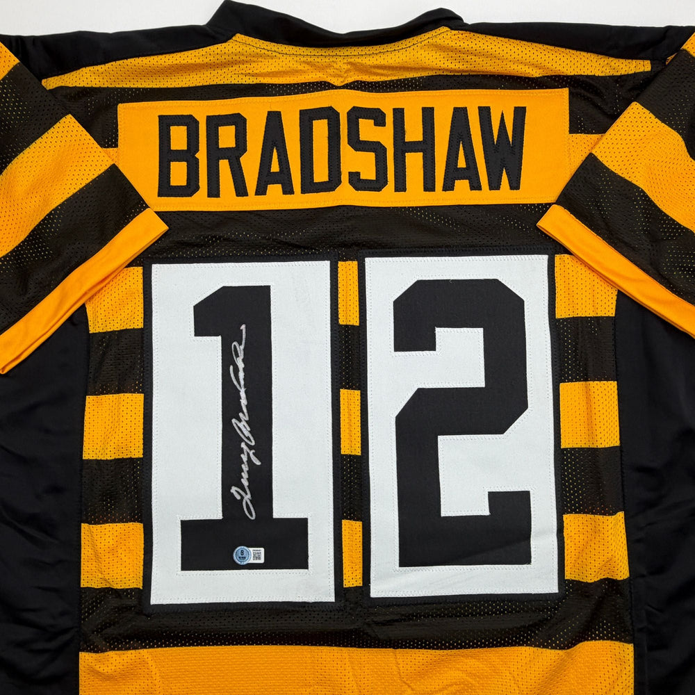 Autographed/Signed Terry Bradshaw Pittsburgh Bumble Bee Football Jersey Beckett BAS COA (ONLINE ORDER ONLY)