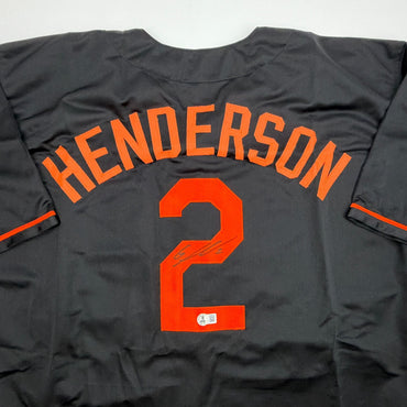 Autographed/Signed Gunnar Henderson Baltimore Black Baseball Jersey Beckett BAS COA (ONLINE ORDER ONLY)