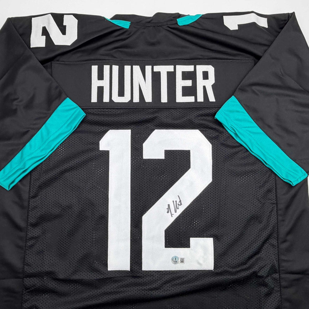 Autographed/Signed Travis Hunter Jacksonville Black Football Jersey Beckett BAS COA