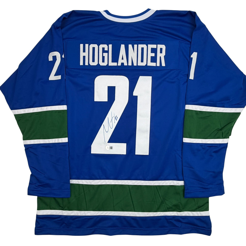 Autographed/Signed Nils Hoglander Vancouver Blue Hockey Jersey Beckett BAS COA (ONLINE ORDER ONLY)