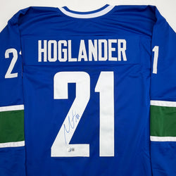 Autographed/Signed Nils Hoglander Vancouver Blue Hockey Jersey Beckett BAS COA (ONLINE ORDER ONLY)