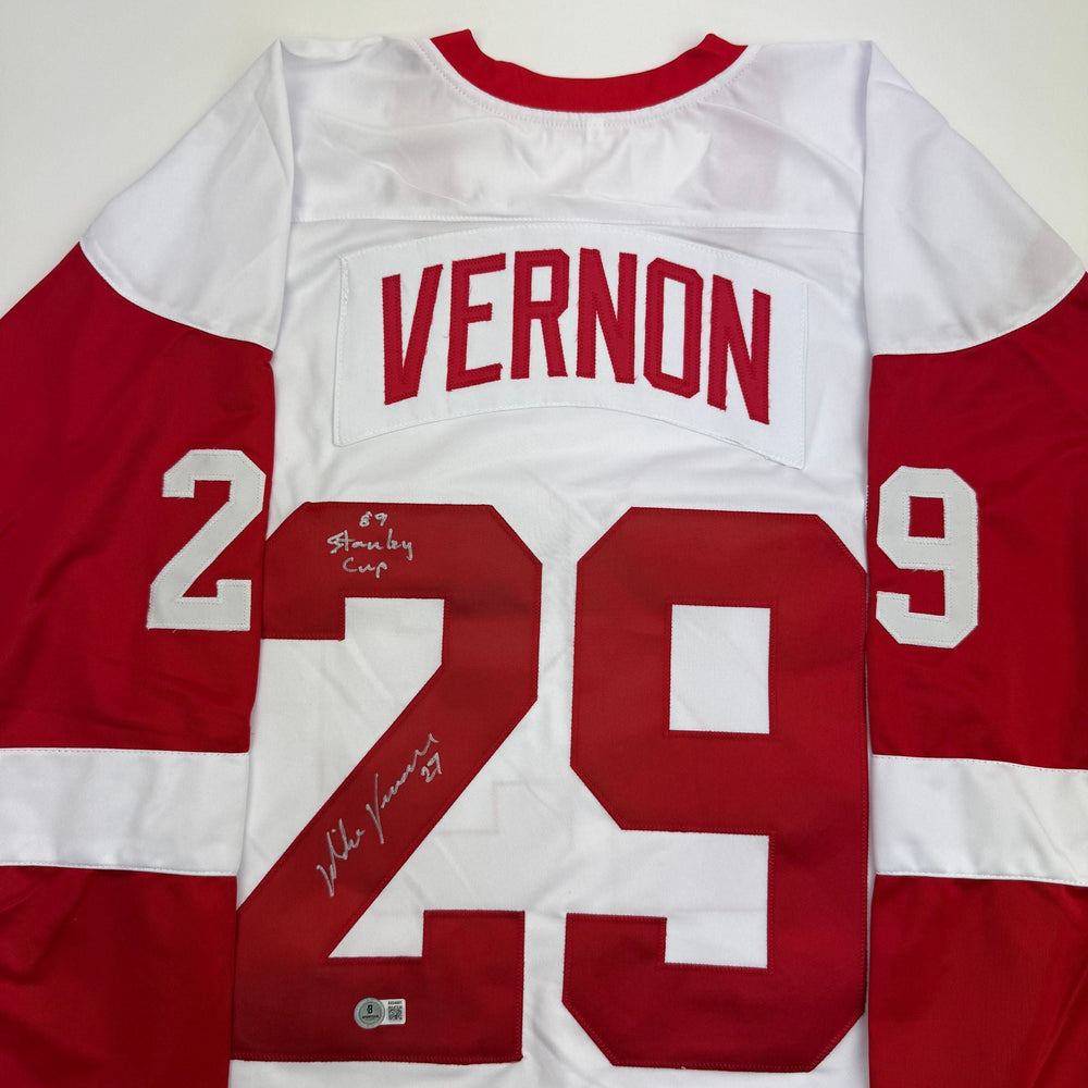 Autographed/Signed Mike Vernon Detroit White Hockey Jersey Beckett BAS COA (ONLINE ORDER ONLY)