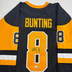 Autographed/Signed Michael Bunting Pittsburgh Black Hockey Jersey Beckett BAS COA (ONLINE ORDER ONLY)