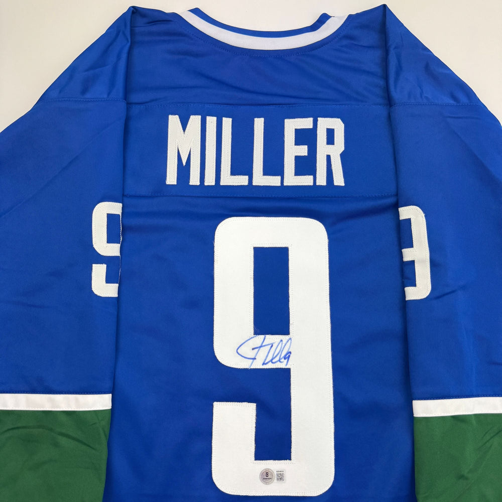Autographed/Signed JT Miller Vancouver Blue Hockey Jersey Beckett BAS COA (ONLINE ORDER ONLY)