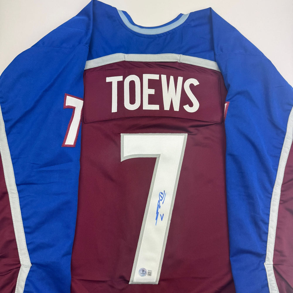 Autographed/Signed Devon Toews Colorado Maroon Hockey Jersey Beckett BAS COA (ONLINE ORDER ONLY)