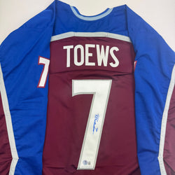 Autographed/Signed Devon Toews Colorado Maroon Hockey Jersey Beckett BAS COA (ONLINE ORDER ONLY)
