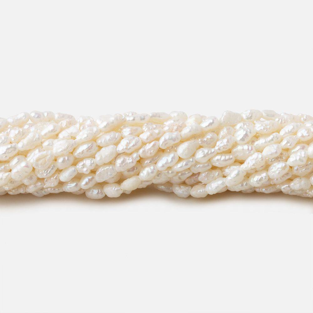 3x2.5-5x2.5mm Off White straight drilled Baroque Rice Freshwater Pearls 16 inch 95 pieces (ONLINE ORDER ONLY)