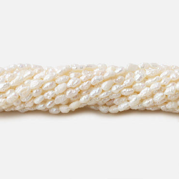 3x2.5-5x2.5mm Off White straight drilled Baroque Rice Freshwater Pearls 16 inch 95 pieces (ONLINE ORDER ONLY)
