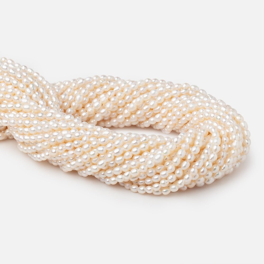 4-4.5mm Creamy White Straight Drill Oval Freshwater Pearls 15.25 inch 98 Beads (ONLINE ORDER ONLY)