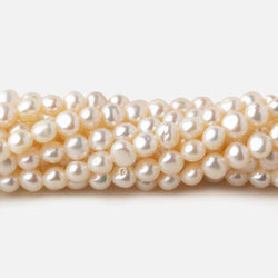 4.5x4-5x4mm Off White side drilled Baroque freshwater pearls 16 inch 90 pieces A (ONLINE ORDER ONLY)