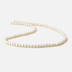 4.5x4-5x4mm Off White side drilled Baroque freshwater pearls 16 inch 90 pieces A (ONLINE ORDER ONLY)