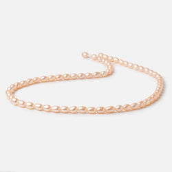 5-5.5mm Peach Petite Oval Freshwater Pearls 15.75 inch 75 Beads (ONLINE ORDER ONLY)