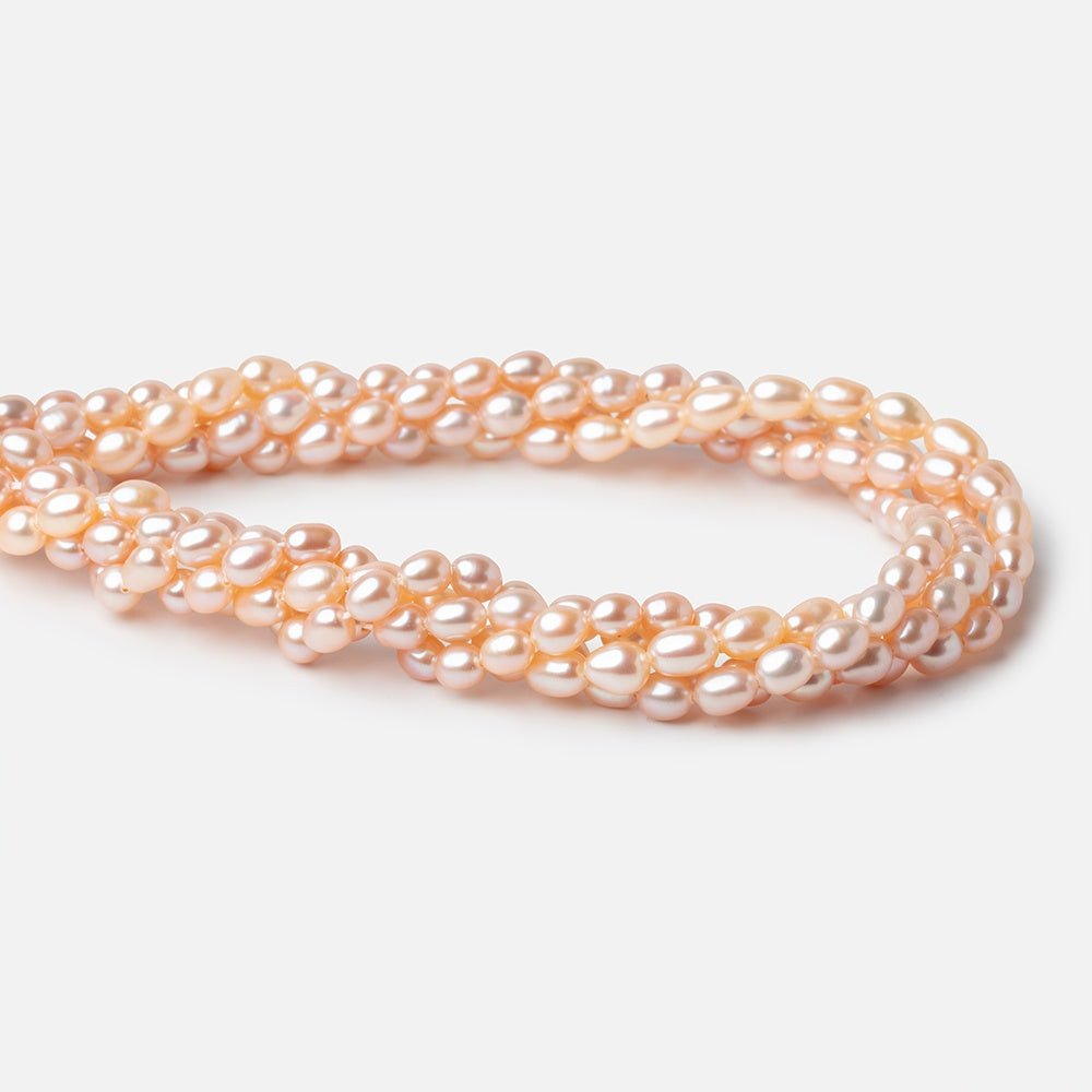 5-5.5mm Peach Petite Oval Freshwater Pearls 15.75 inch 75 Beads (ONLINE ORDER ONLY)