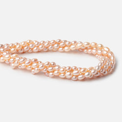 5-5.5mm Peach Petite Oval Freshwater Pearls 15.75 inch 75 Beads (ONLINE ORDER ONLY)