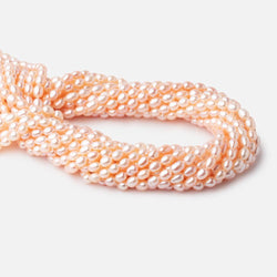 5.5x4mm Peach Straight Drill Oval Freshwater Pearl beads 15 inch 66 pieces (ONLINE ORDER ONLY)