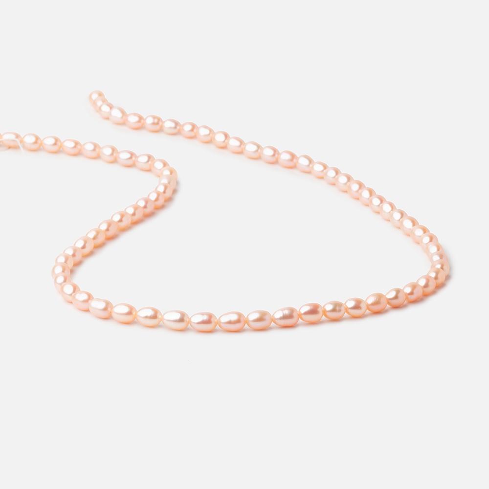 5.5x4mm Peach Straight Drill Oval Freshwater Pearl beads 15 inch 66 pieces (ONLINE ORDER ONLY)