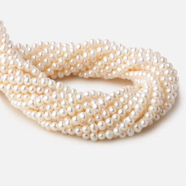 5-5.5mm Off White side drilled Off Round freshwater pearls 15 inch 78 pieces A (ONLINE ORDER ONLY)