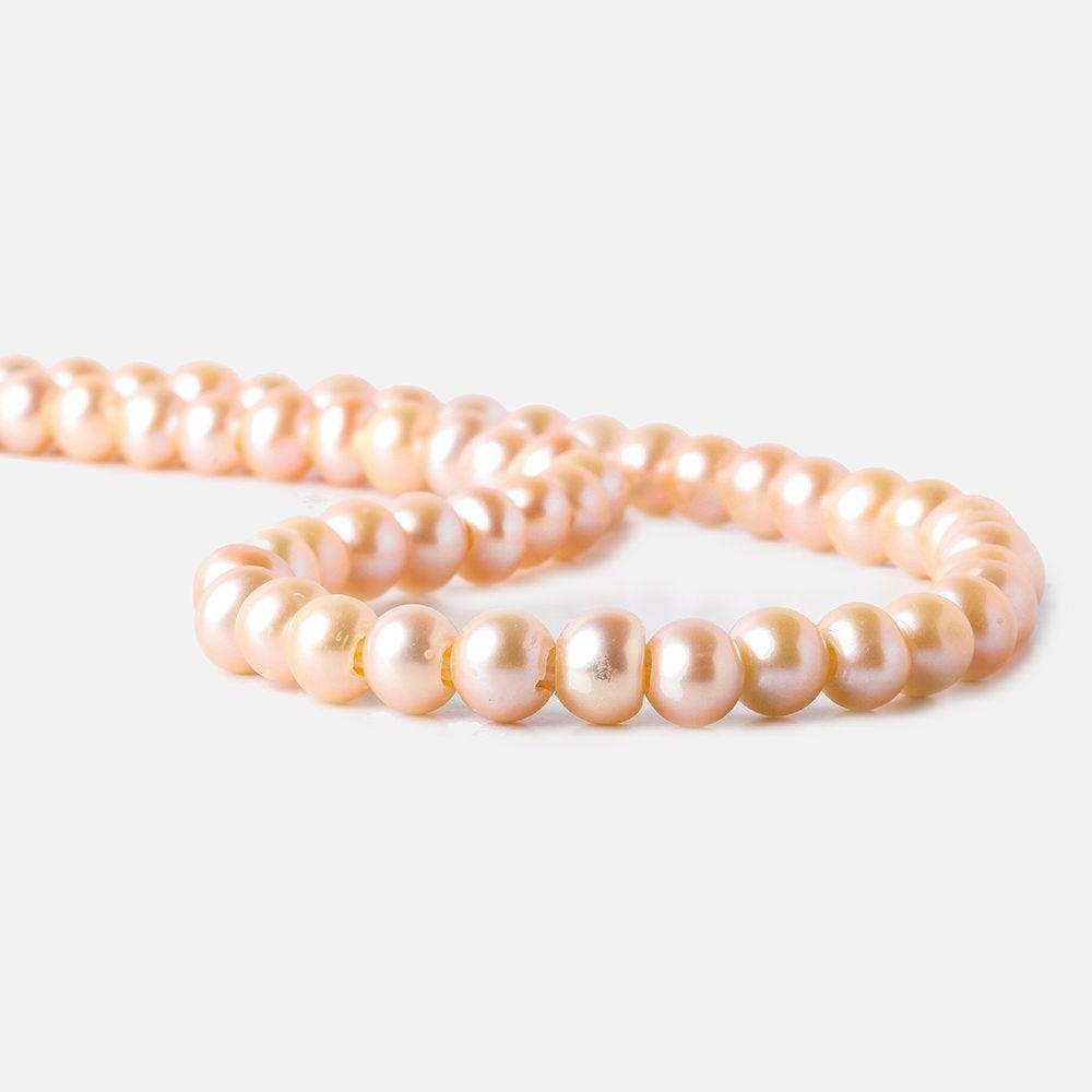 6-7mm Creamsicle Large Hole Off Round Freshwater Pearl 2.5mm drill hole, 15 inch, 75 pieces (ONLINE ORDER ONLY)