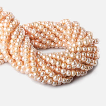 6-7mm Creamsicle Large Hole Off Round Freshwater Pearl 2.5mm drill hole, 15 inch, 75 pieces (ONLINE ORDER ONLY)