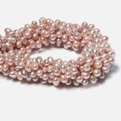 7x5-8x6mm Peachy Pink Top Drilled Oval Freshwater Pearls 16 inch 74 pieces (ONLINE ORDER ONLY)
