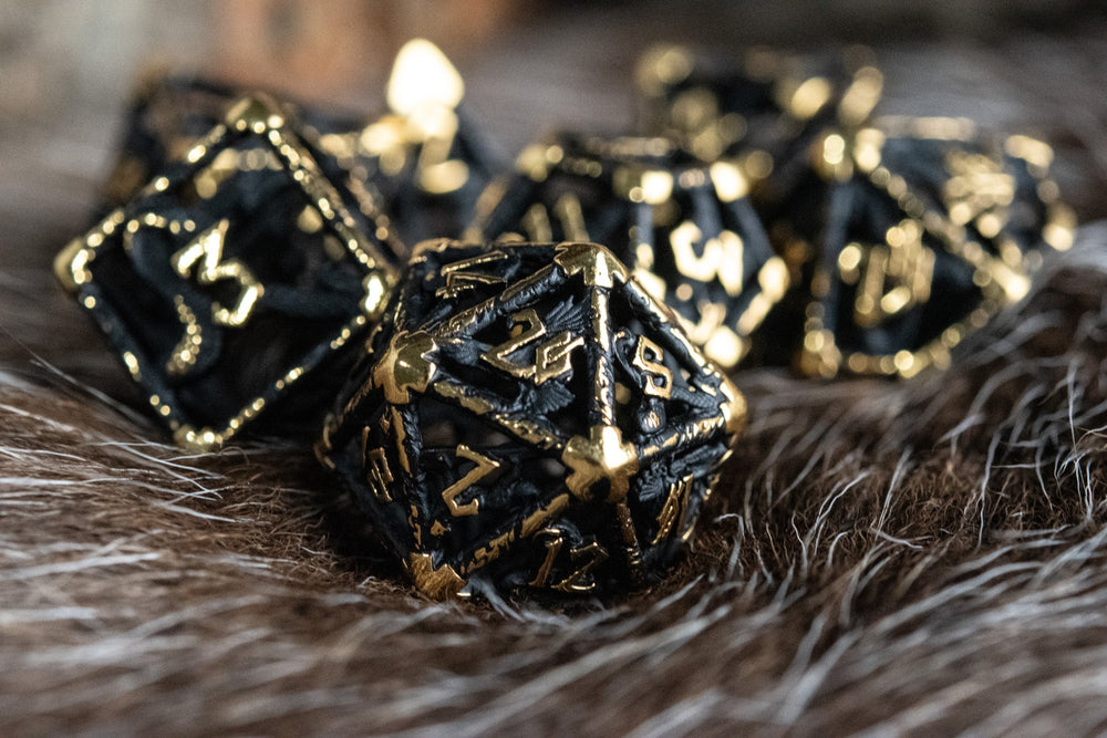 Legends of Valhalla - Matte Black and Gold Hollow Metal Dice Set (ONLINE ORDER ONLY)