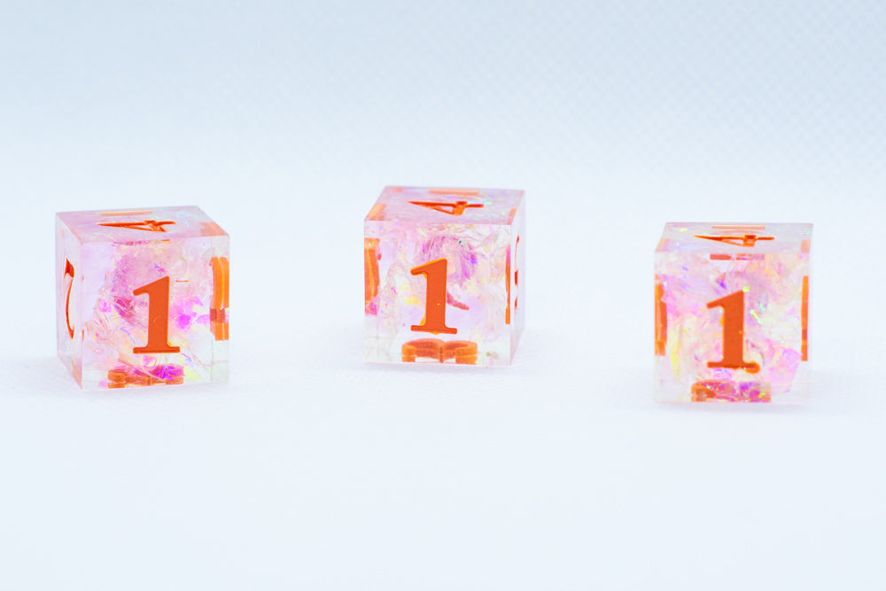 Nectar Sharp Edge Resin d6-Dice (Clear Shimmer w/ Orange Numbers) [subtle imperfection] (Online Only)
