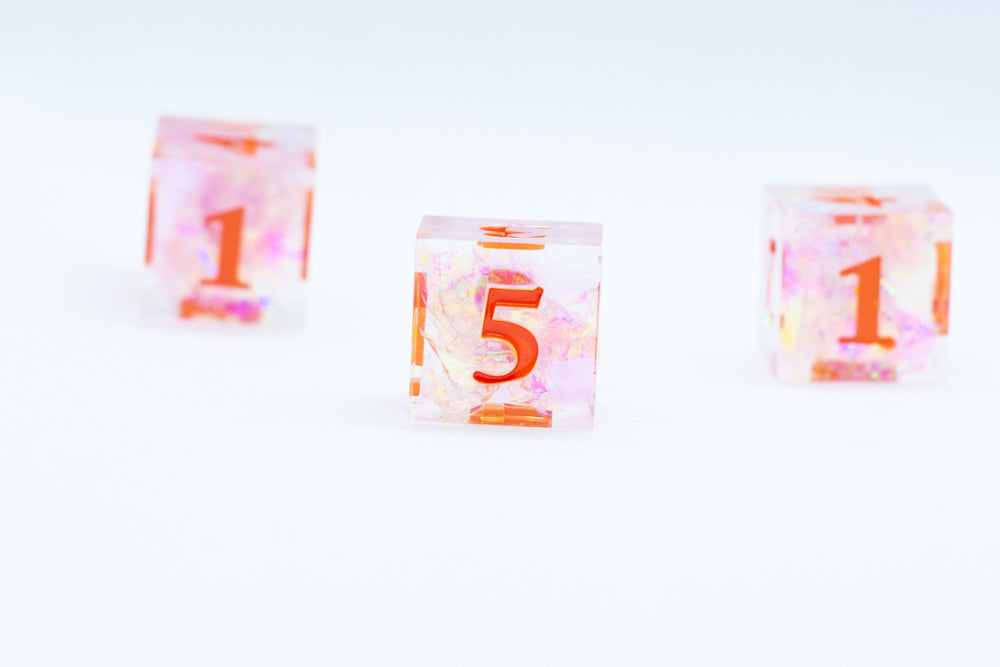 Nectar Sharp Edge Resin d6-Dice (Clear Shimmer w/ Orange Numbers) [subtle imperfection] (Online Only)