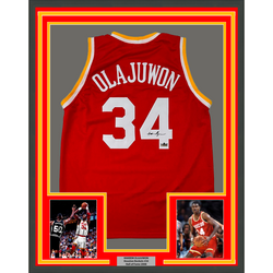 Framed Facsimile Autographed Hakeem Olajuwon 35x39 Houston Red Reprint Laser Auto Basketball Jersey (ONLINE ORDER ONLY)