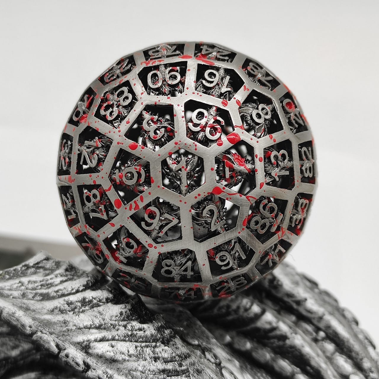 Metal d100 | Silver Hollow Body w/Blood Splatter Paint RPG Dice (Online Only)