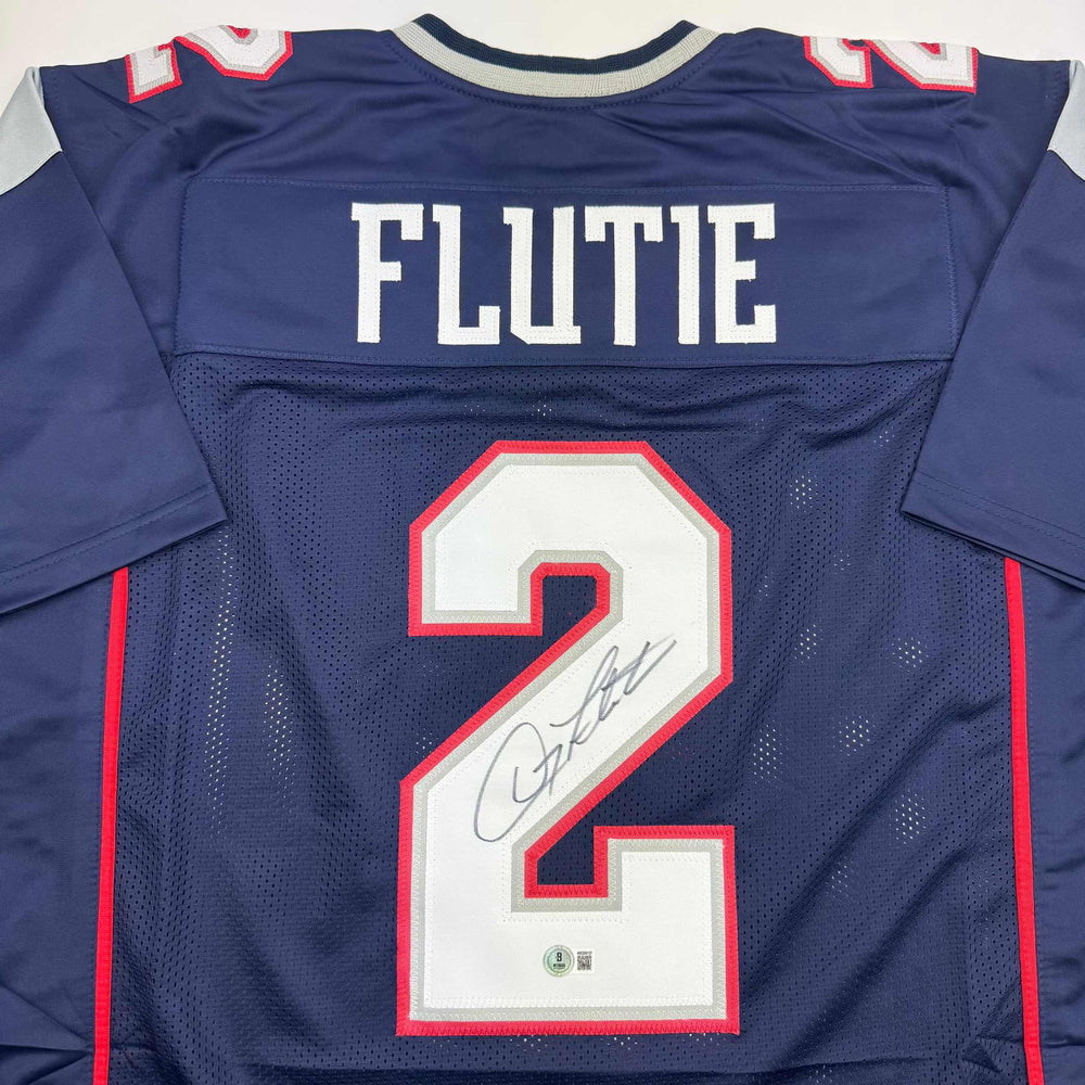 Autographed/Signed Doug Flutie New England Blue Football Jersey Beckett BAS COA