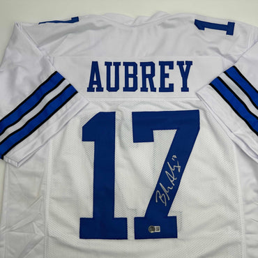 Autographed/Signed Brandon Aubrey Dallas White Football Jersey Beckett BAS COA (ONLINE ORDER ONLY)