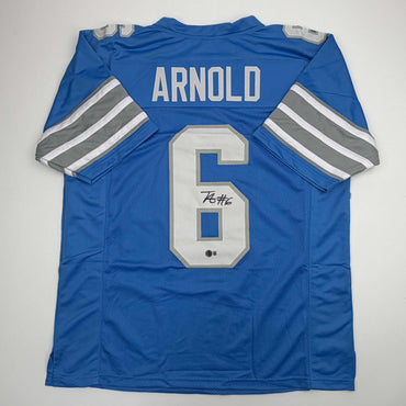 Autographed/Signed Terrion Arnold Detroit Blue Football Jersey Beckett BAS COA (ONLINE ORDER ONLY)