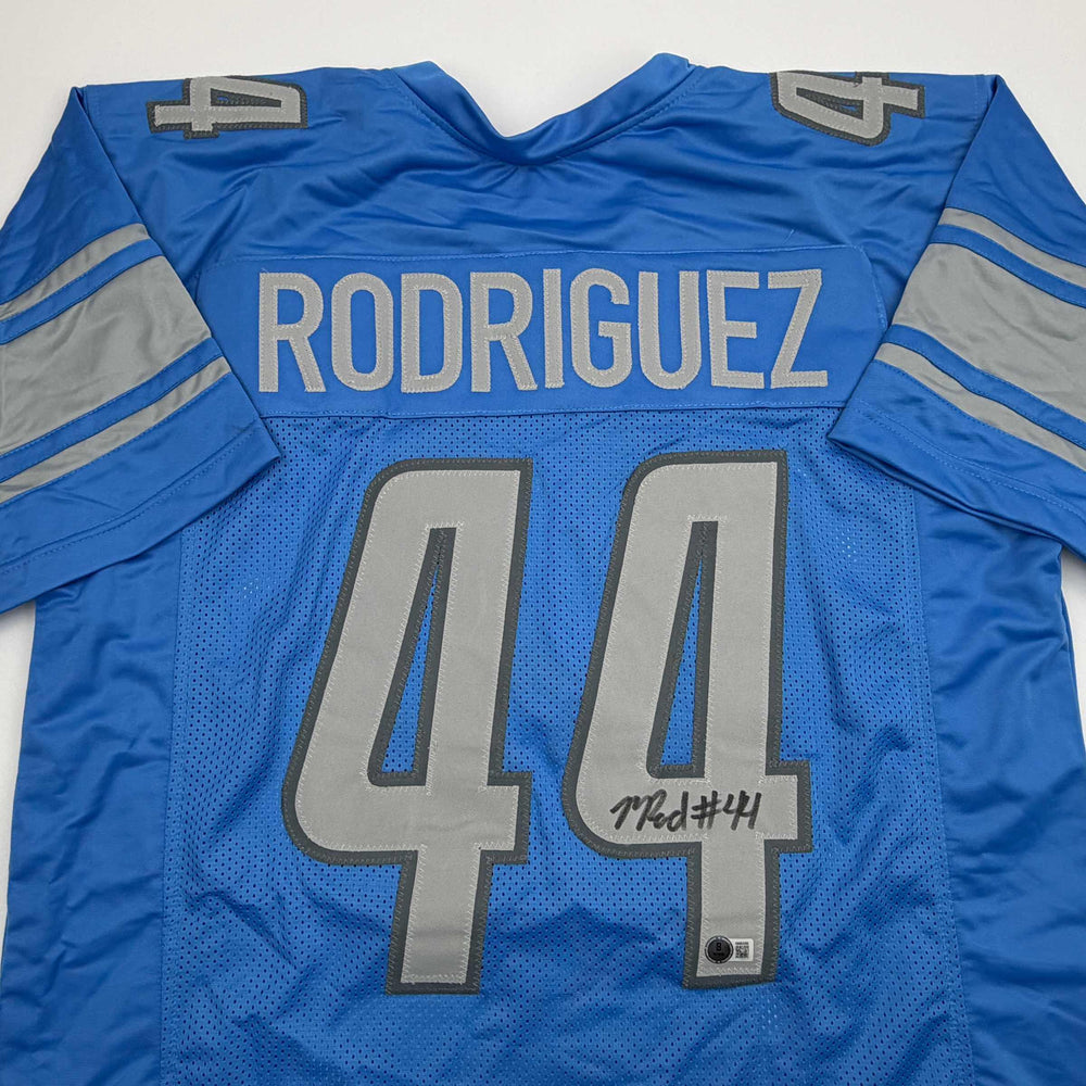 Autographed/Signed Malcolm Rodriguez Detroit Blue Football Jersey Beckett BAS COA (ONLINE ORDER ONLY)