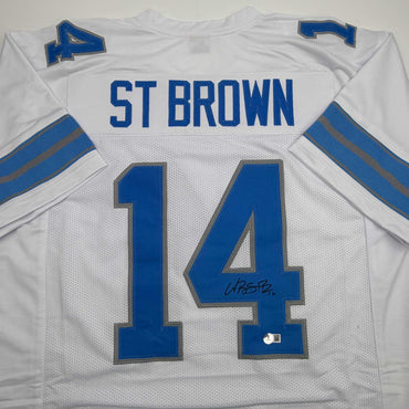 Autographed/Signed Amon-Ra St. Brown Detroit White Football Jersey Beckett BAS COA (ONLINE ORDER ONLY)