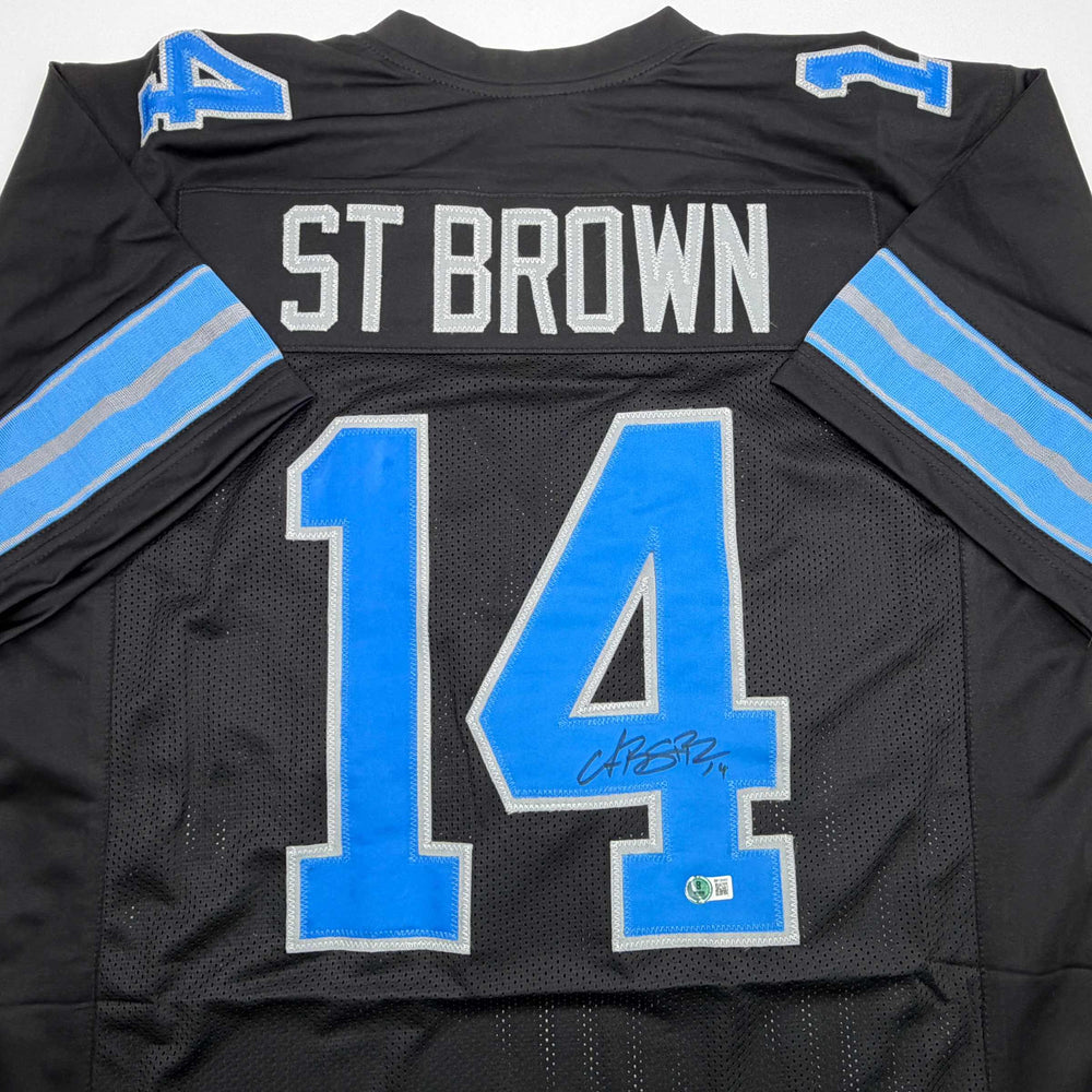 Autographed/Signed Amon-Ra St. Brown Detroit Black Football Jersey Beckett BAS COA (ONLINE ORDER ONLY)