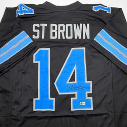 Autographed/Signed Amon-Ra St. Brown Detroit Black Football Jersey Beckett BAS COA (ONLINE ORDER ONLY)