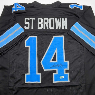 Autographed/Signed Amon-Ra St. Brown Detroit Black Football Jersey Beckett BAS COA (ONLINE ORDER ONLY)