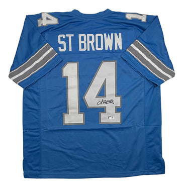 Autographed/Signed Amon-Ra St. Brown Detroit Current Blue Football Jersey Beckett BAS COA (ONLINE ORDER ONLY)