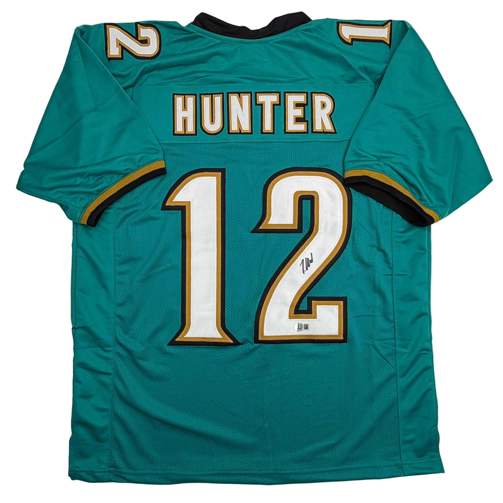 Autographed/Signed Travis Hunter Jacksonville Teal Retro Football Jersey Beckett BAS COA (ONLINE ORDER ONLY)