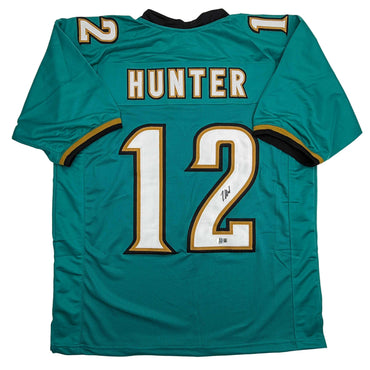 Autographed/Signed Travis Hunter Jacksonville Teal Retro Football Jersey Beckett BAS COA (ONLINE ORDER ONLY)