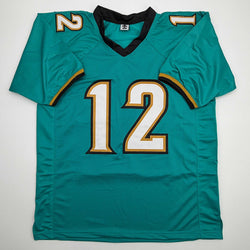 Autographed/Signed Travis Hunter Jacksonville Teal Retro Football Jersey Beckett BAS COA (ONLINE ORDER ONLY)