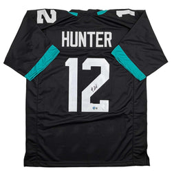Autographed/Signed Travis Hunter Jacksonville Black Football Jersey Beckett BAS COA (ONLINE ORDER ONLY)