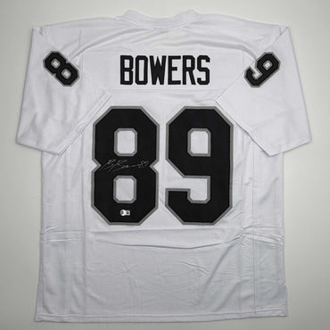 Autographed/Signed Brock Bowers Las Vegas Oakland White Football Jersey Beckett BAS COA (ONLINE ORDER ONLY)