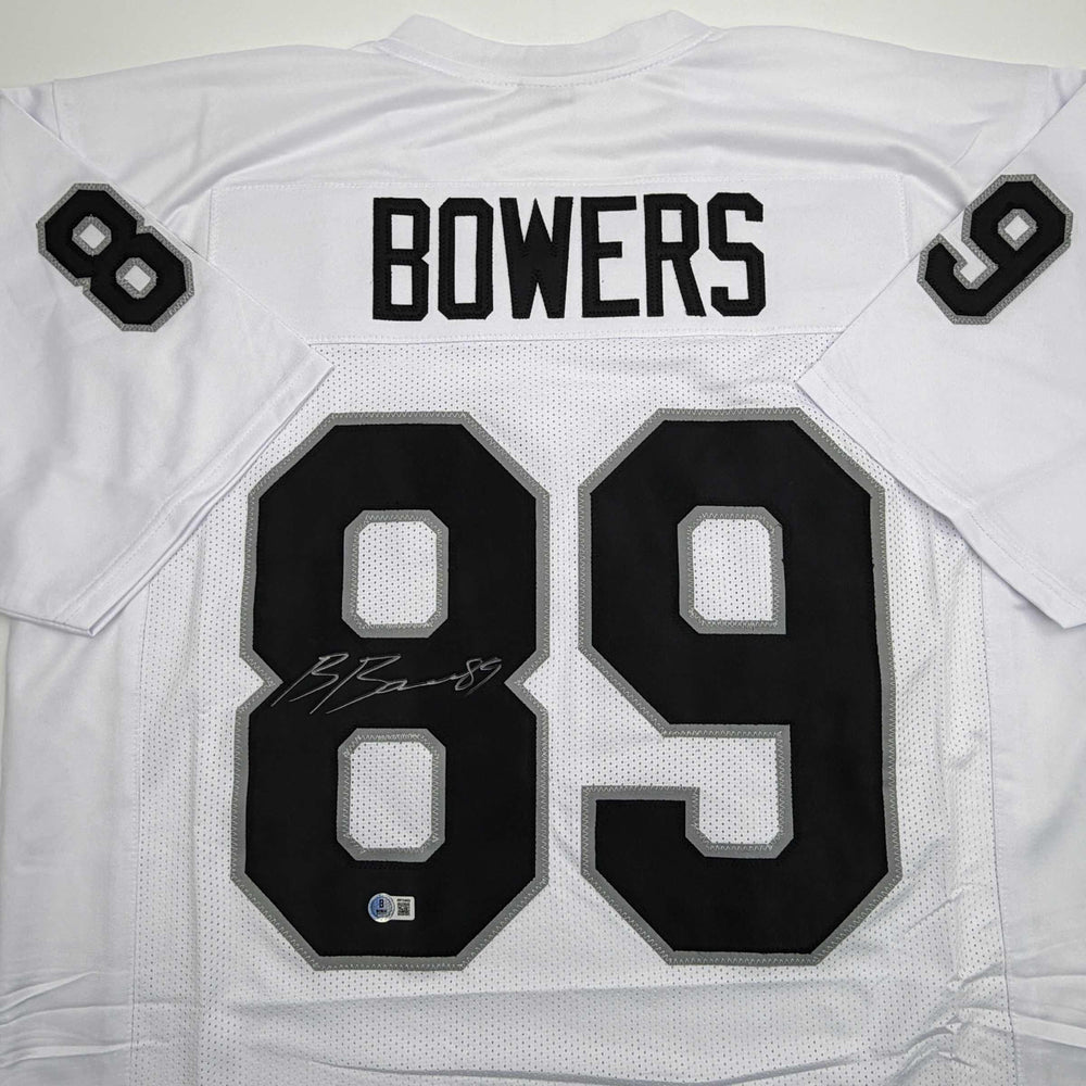 Autographed/Signed Brock Bowers Las Vegas Oakland White Football Jersey Beckett BAS COA (ONLINE ORDER ONLY)