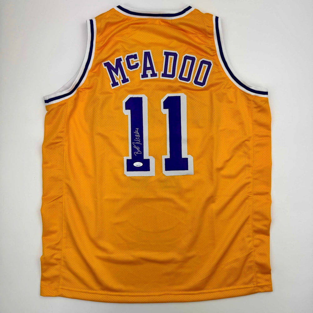Autographed/Signed Bob McAdoo Los Angeles Yellow Basketball Jersey JSA COA (ONLINE ORDER ONLY)