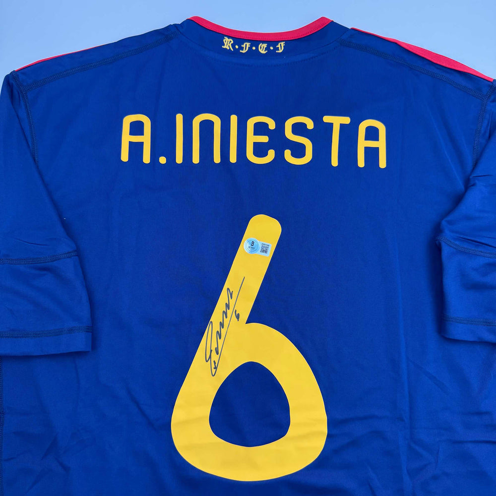 Autographed/Signed Andres Iniesta Spain Blue World Cup Soccer Futbol Jersey Beckett BAS COA (ONLINE ORDER ONLY)