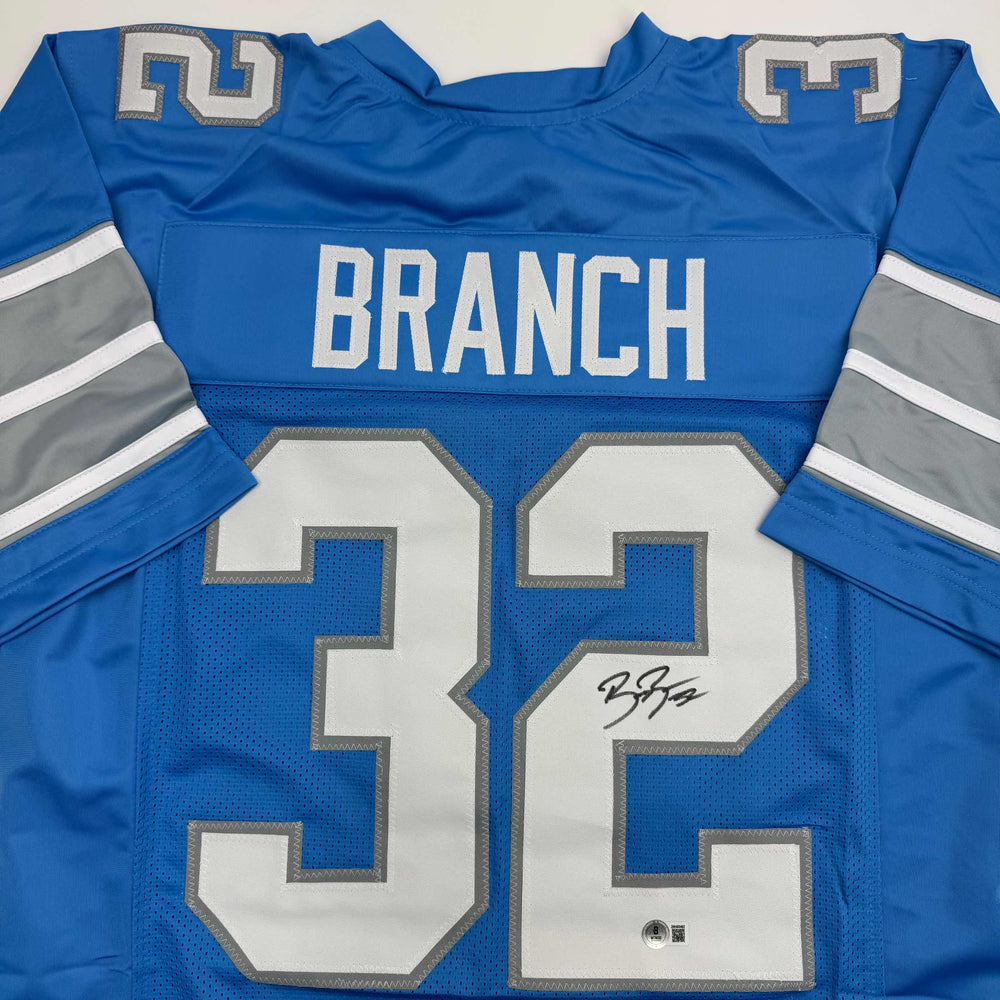 Autographed/Signed Brian Branch Detroit Blue Football Jersey Beckett BAS COA (ONLINE ORDER ONLY)
